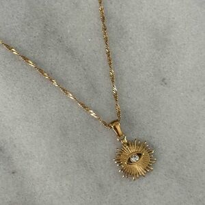 COPY - Gold Sun Burst Evil Eye Crystal Pendant Necklace 

Brand New